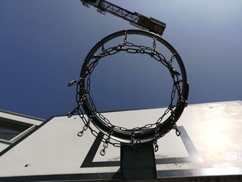 Low angle view of basketball hoop against sky