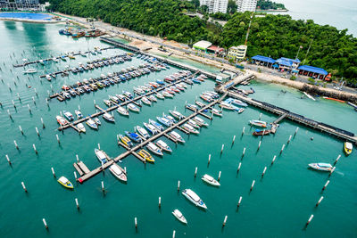 High angle view of boats moored at harbor