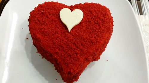 High angle view of heart shape cake on plate