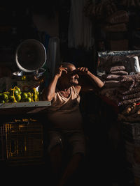 Midsection of woman sitting in basket