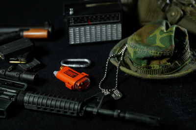 High angle view of ammunitions and hat on table