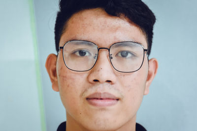 Close-up portrait of serious young man