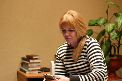 Portrait of young woman using mobile phone