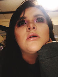 Close-up portrait of woman at home