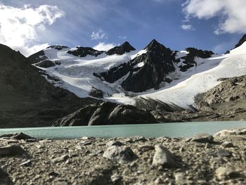 Scenic view of snowcapped mountains against sky