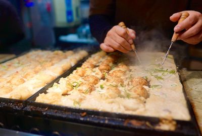 Making takoyaki in japán. street food.