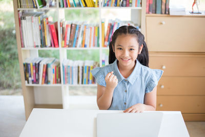 Portrait of smiling girl in library