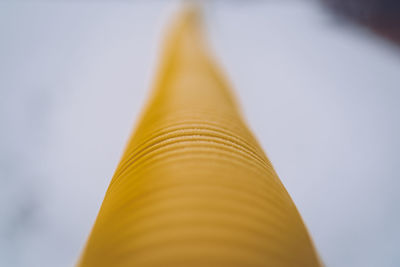 Close-up low angle view of yellow tube