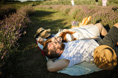 High angle view of woman lying on field