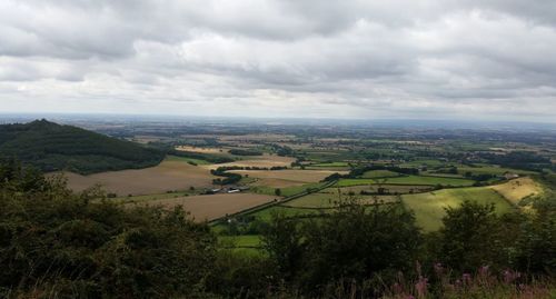 Scenic view of landscape against cloudy sky