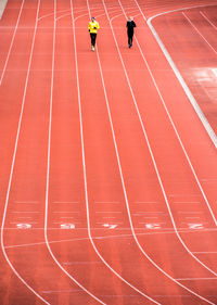 High angle view of athlete practicing on running track