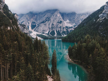 Scenic view of lake and mountains against sky