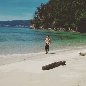 Full length of man on beach against sky