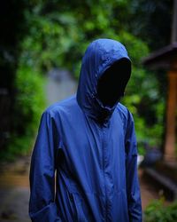Person in blue hooded shirt