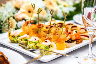 High angle view of appetizer arranged in plate on table at garden party