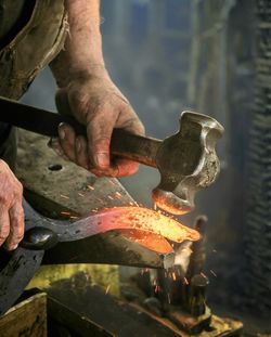 Cropped hand of man preparing food