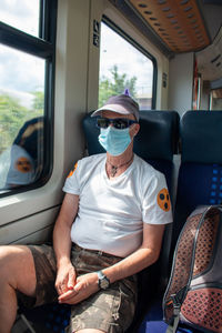 Man sitting in train