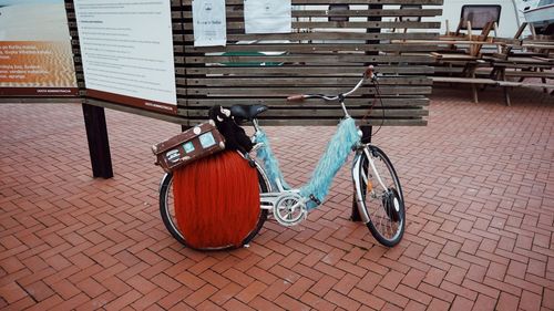 Bicycle on cobblestone street in city