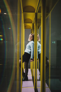 Woman looking through window