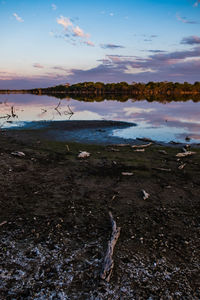 Scenic view of sea against sky at sunset