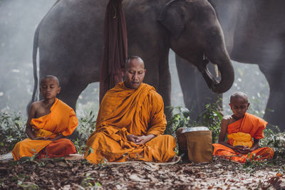 Group of people sitting in temple