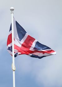 Low angle view of flag against sky