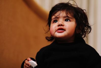 Portrait of cute baby at home