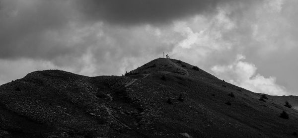 Low angle view of rock against sky