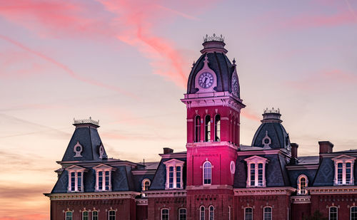 Low angle view of building against sky during sunset