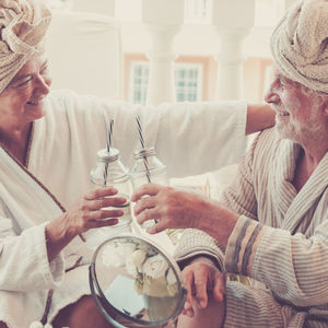 Midsection of couple holding hands