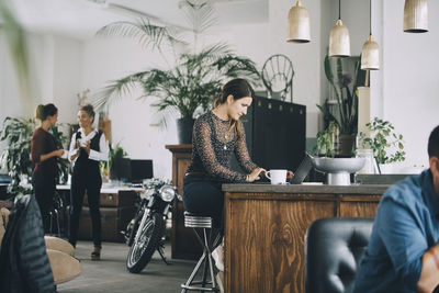 People working on table in restaurant