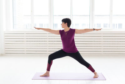 Full length of woman with arms outstretched