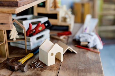 Close-up of model home on workbench