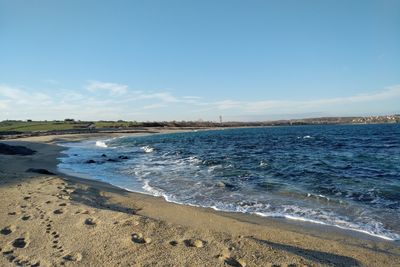 Scenic view of beach against sky