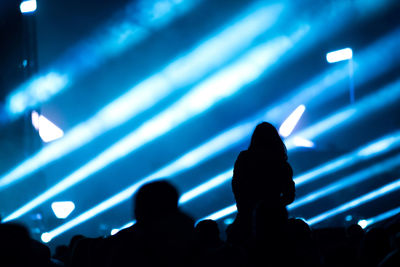 Silhouette people at music concert