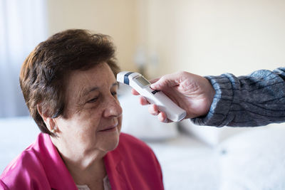 Close-up of doctor holding syringe