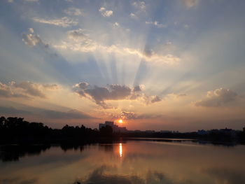 Scenic view of lake against sky during sunset