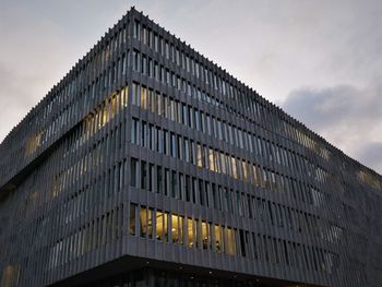 A modern office building on a cloudy day in berlin. 