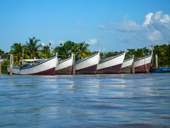 View of swimming pool by sea against sky