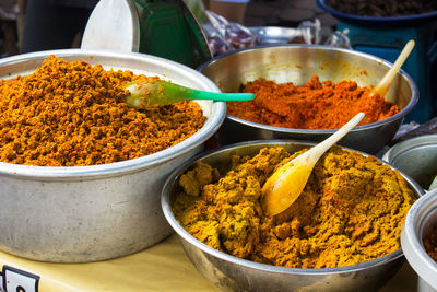 Close-up of spices in container on table for sale at market