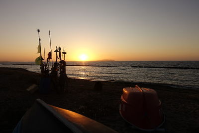 Scenic view of sea against clear sky during sunset