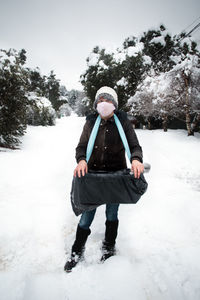 Full length of man on snow covered field