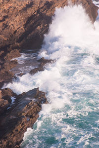 Sea waves splashing on rocks