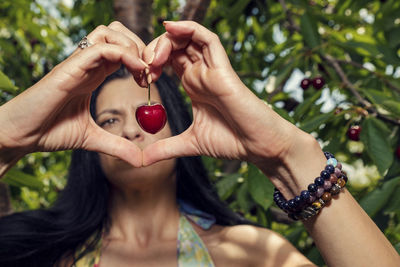 Midsection of woman holding fruits