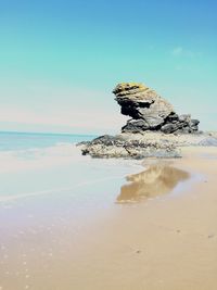 Scenic view of sea against blue sky