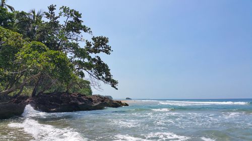 Scenic view of sea against clear blue sky