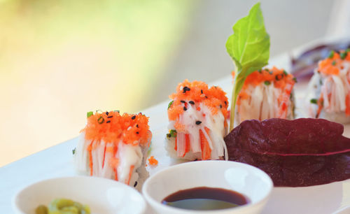 Close-up of sushi served on table