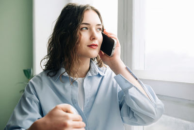 Young woman using mobile phone