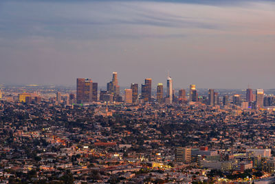 Aerial view of modern buildings in city against sky