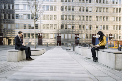 People sitting in front of building